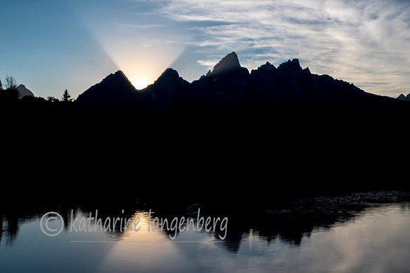 Sunset lightbeams over the Grand  Teton Moutain Range